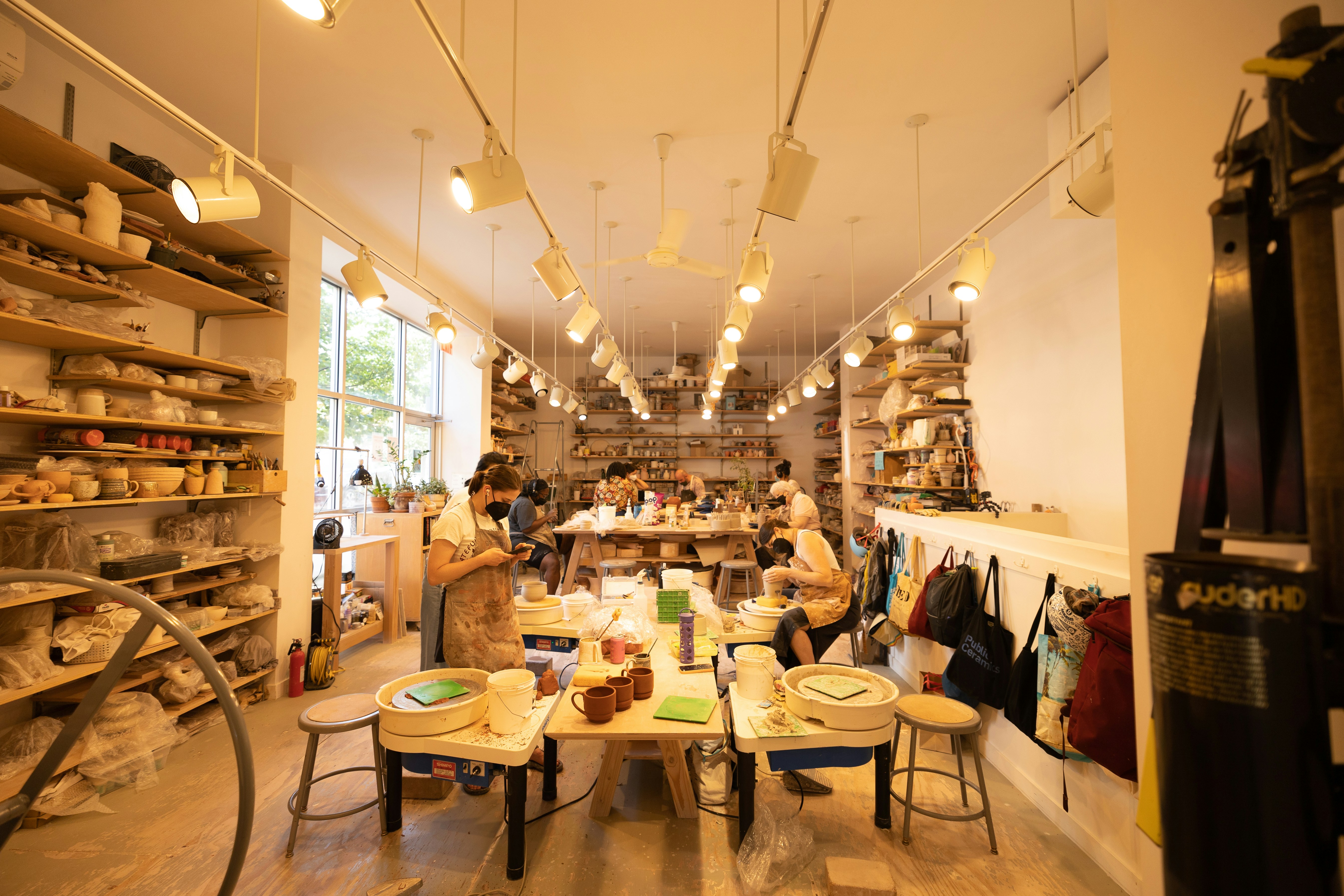Students doing pottery and knitting