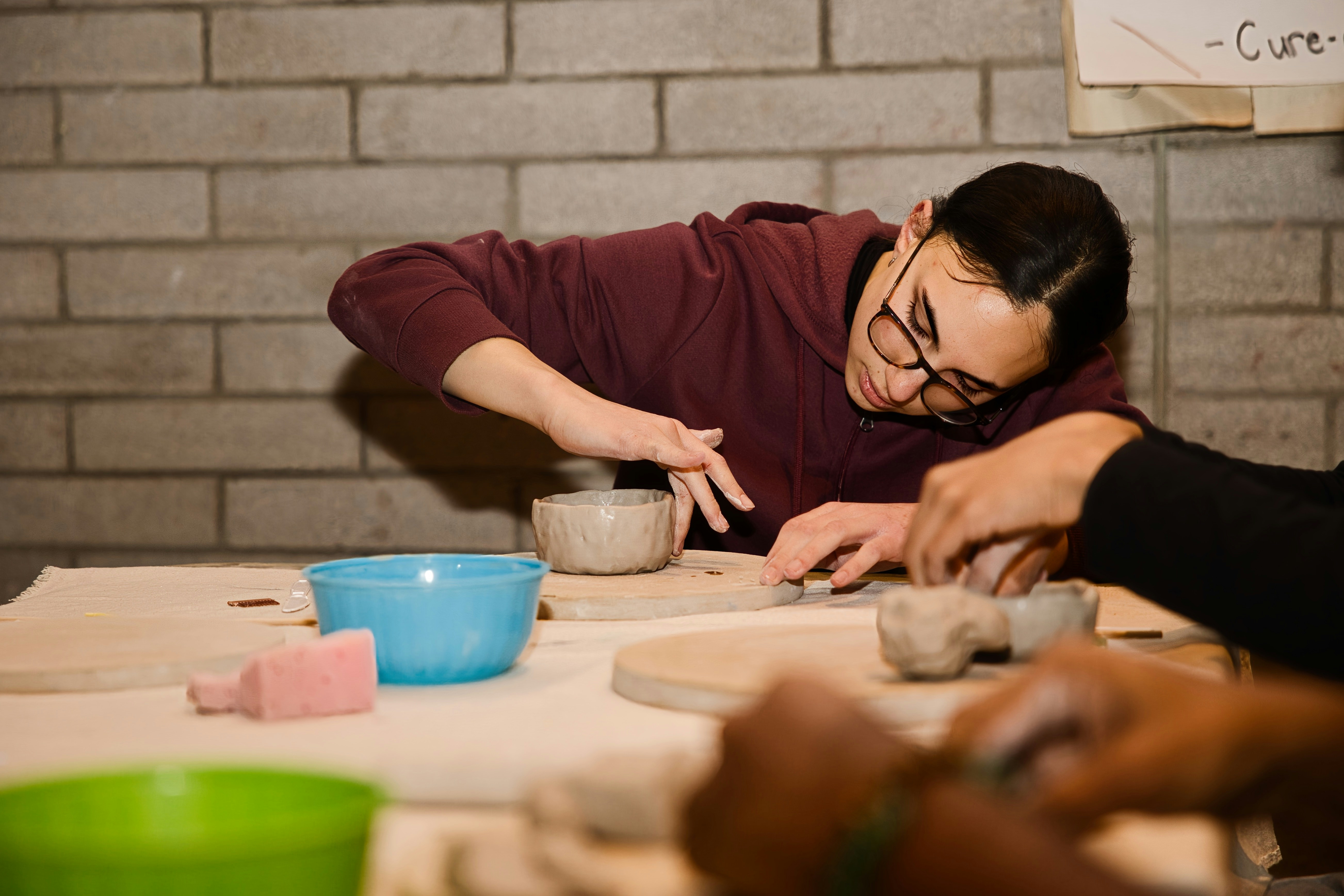 Students doing hand building pottery